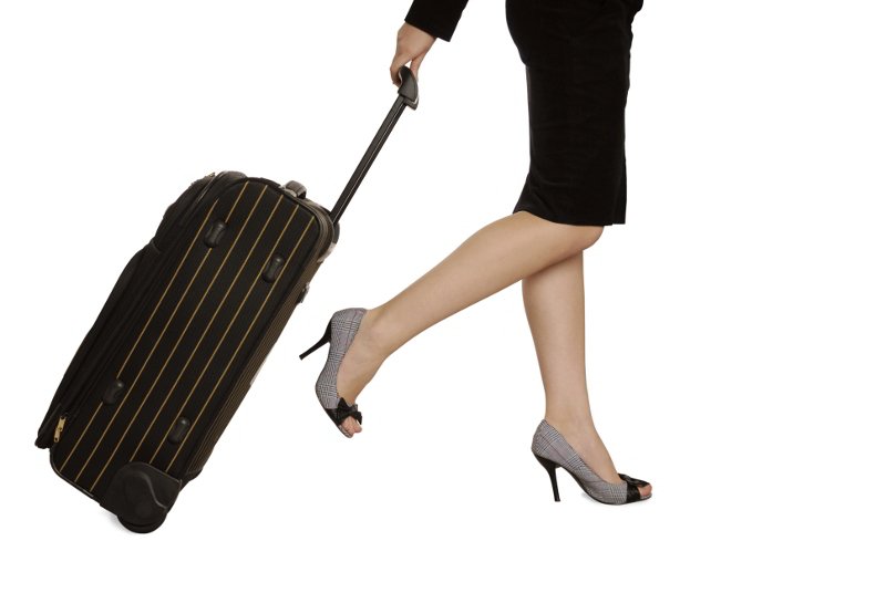 Γυναίκα Επιχειρηματίας κρατά βαλίτσα